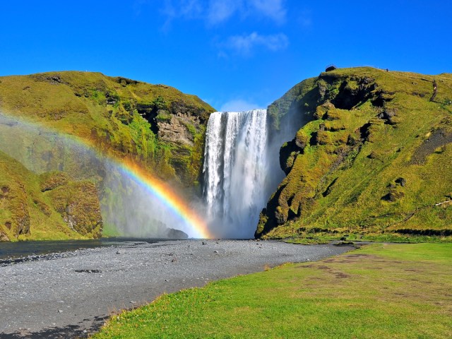 Rainbow over Skogafoss waterfall in Iceland