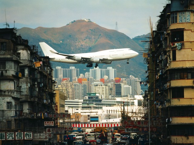 Boeing 747 on approach to Kai Tak Airport over densely populated area