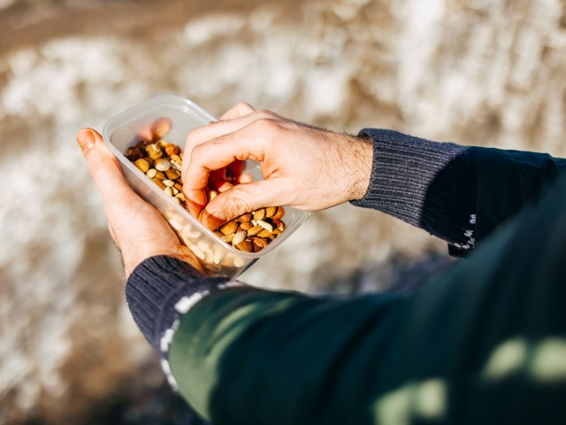 Person eating nuts