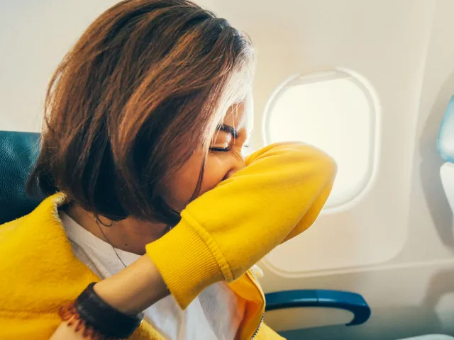 Passenger sneezing on airplane