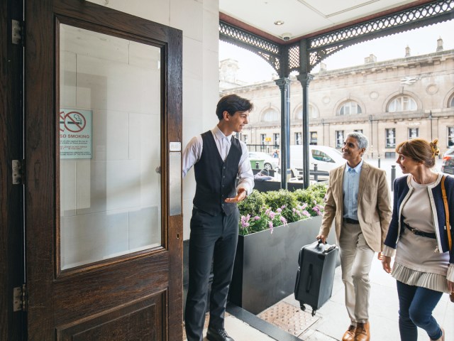 Doorperson welcoming hotel guests