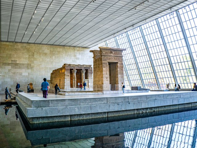 Museum goers viewing the Temple of Dendur at the Met Museum in New York City