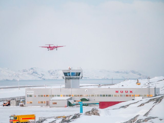 Plane taking off from snowy airport
