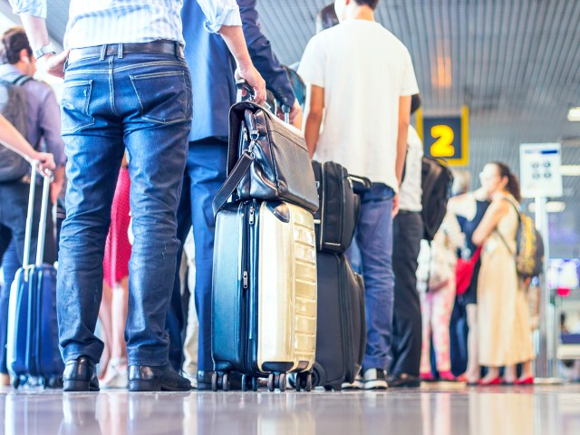 Airline passengers lined up to board at gate