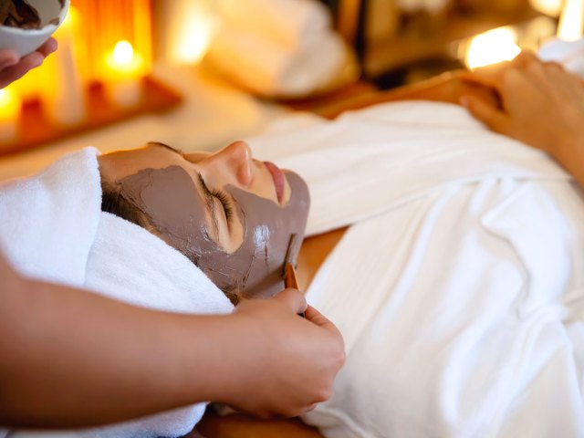 Woman receiving facial at spa