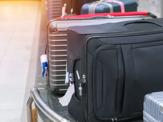 Luggage on carousel at baggage claim