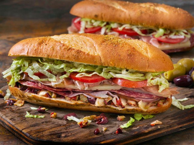 A muffaletta sandwich on a cutting board