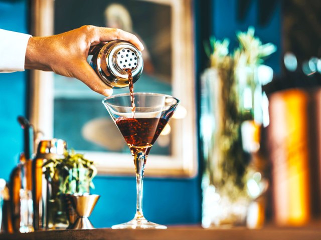 Bartender pouring cocktail