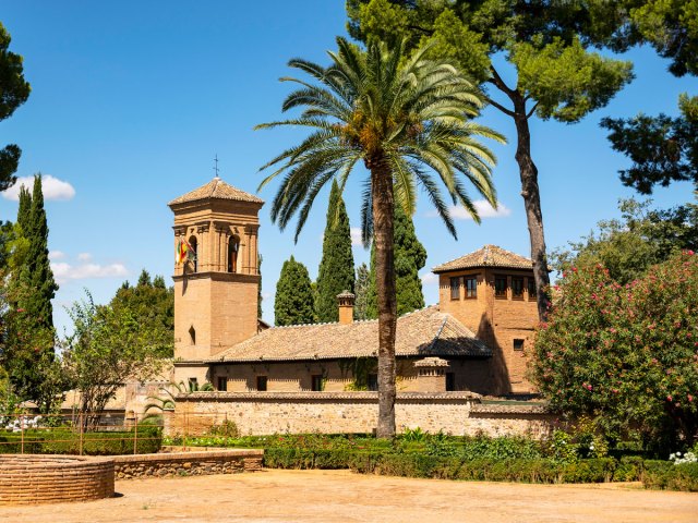 Parador de Granada surrounded by palm trees