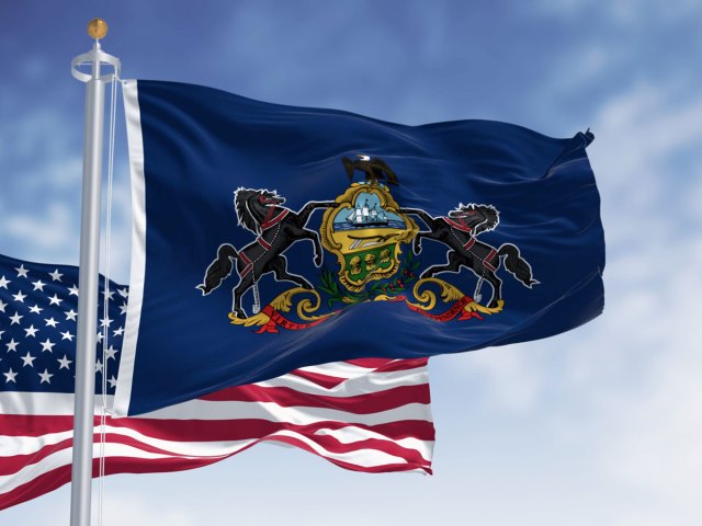 Pennsylvania flag flying beside American flag