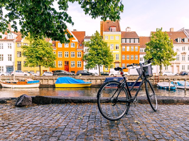 Bicycle parked along canal in Copenhagen, Denmark