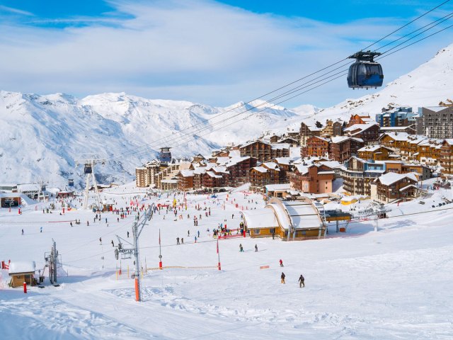 Chairlift and skiers in Val Thorens, France