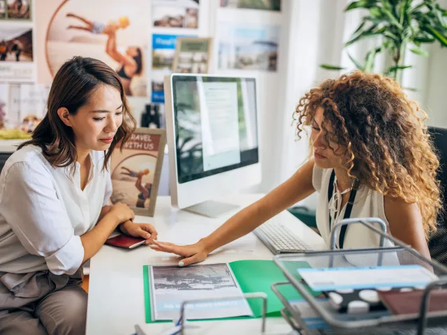 Woman speaking with travel agent