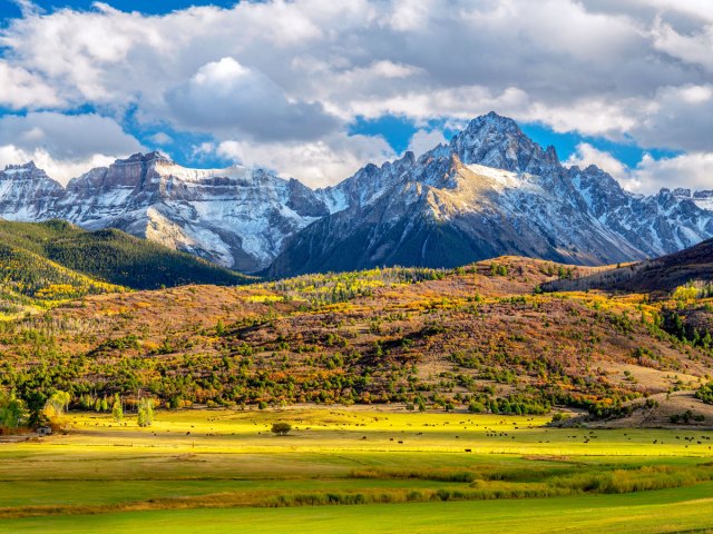 Autumn landscape with mountains and cattle ranch in Colorado
