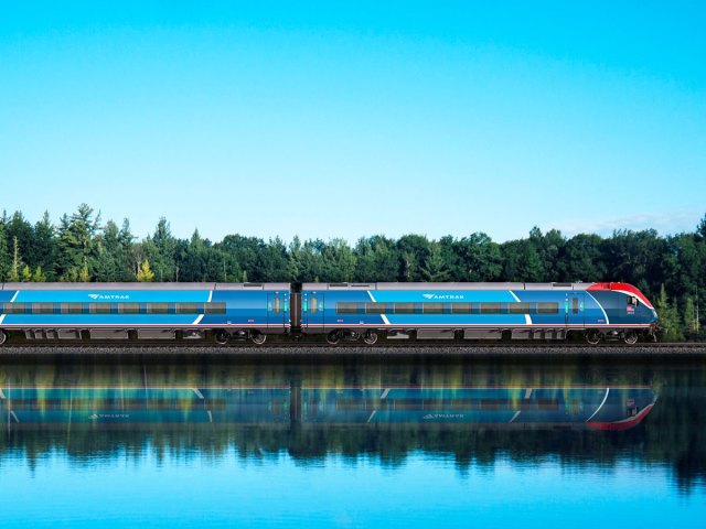 Amtrak train with reflection on lake