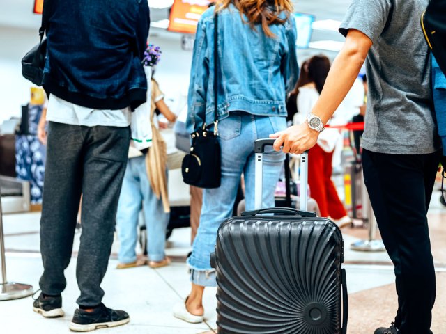 Passengers crowding around gate area