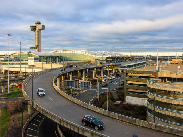 Aerial view of roadway, terminals, and control tower at JFK Airport in New York City