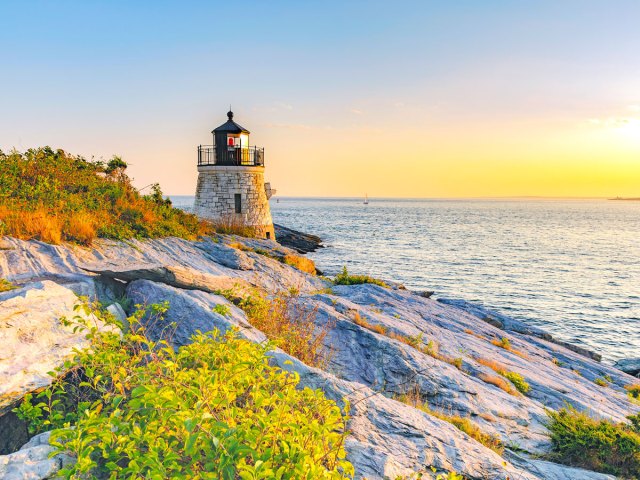 Lighthouse in Rhode Island overlooking the Atlantic Ocean at sunset