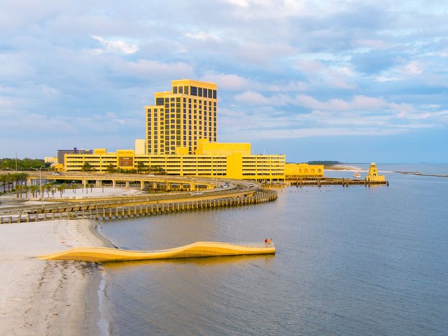 Bright yellow resort on beach in Biloxi, Mississippi
