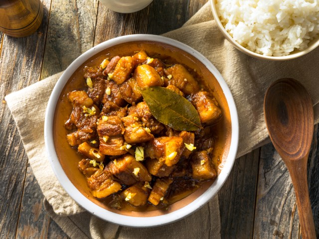 Plate of Filipino adobo on cutting board