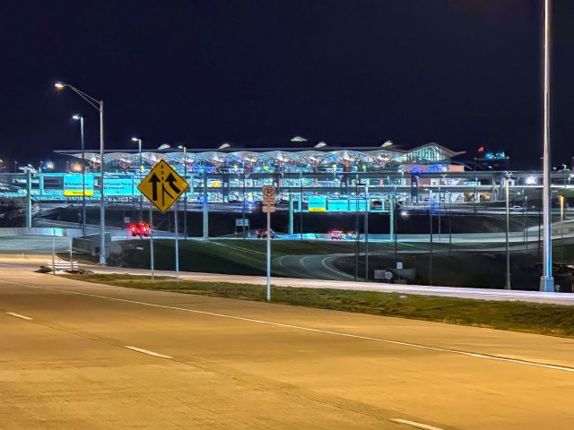 Roadway leading to new Pittsburgh Airport terminal illuminated at night