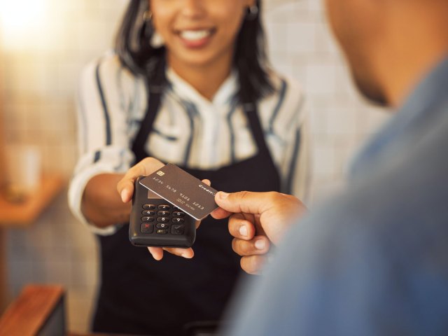 Customer tapping card on credit card payment machine