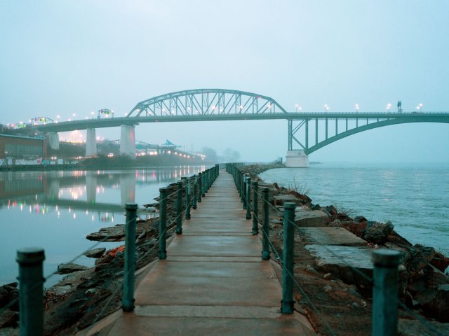 Waterfront path and bridge under cloudy skies in Buffalo, New York