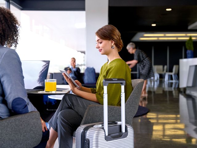 Travelers relaxing in airport lounge