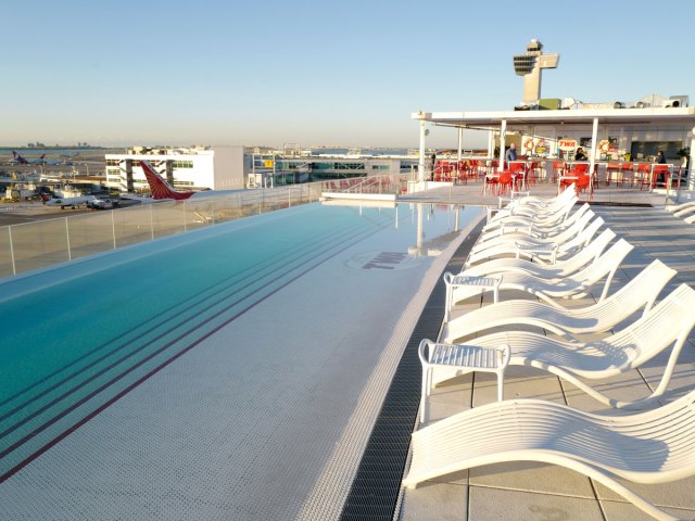Infinity pool at TWA Hotel overlooking New York's JFK Airport