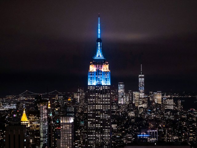 Empire State Building and Manhattan skyline illuminated at night