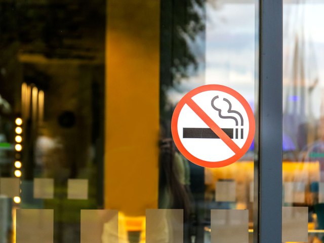No-smoking sign posted on window