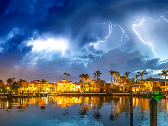 Lightning over waterfront homes in Florida
