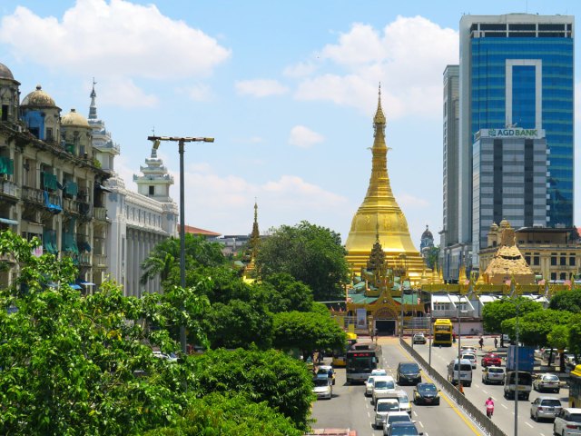Traffic in front of the golden dome of Sule Pagoda in Yangon, Myanmar