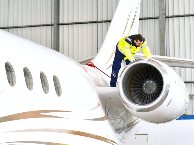 Mechanic inspecting aircraft engine