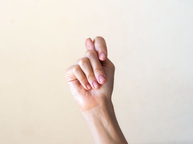 Person making the fig gesture