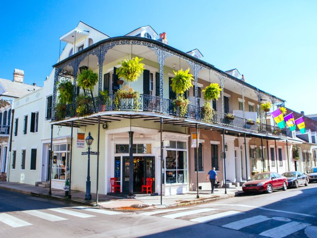 Two-story building with wrought-iron balcony in New Orleans 