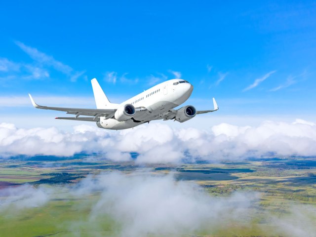 White airplane in flight