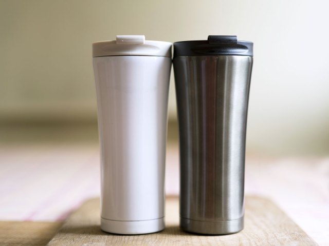 Pair of insulated coffee mugs on counter
