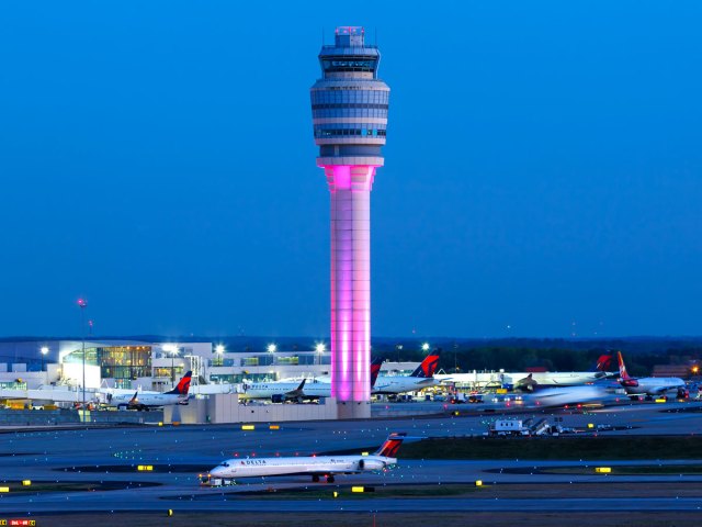 Control tower and aircraft taxing at Hartsfield-Jackson International Airport